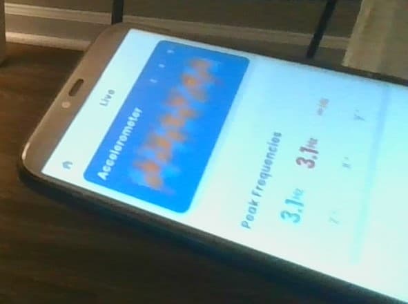 Experimental accelerometer result showing a measured first mode frequency of 3.1 Hz